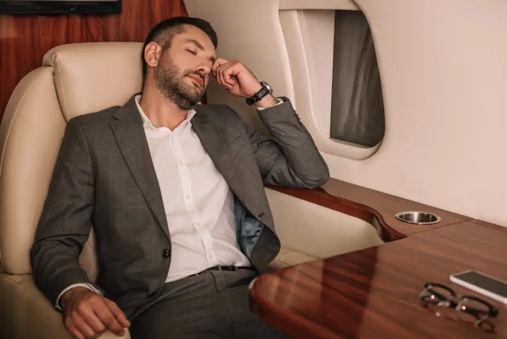 Passenger relaxing in a private jet cabin in Dubai